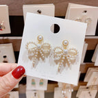 Long Bow Pearl Earrings