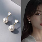 Scalloped cat's eye pearl stud earrings