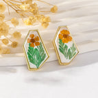 Orange Flowers and Green Leaves on White Background