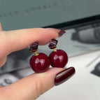 206 burgundy pearl earrings