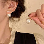 Simple one-word pearl earrings