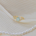 A sea blue oval open ring