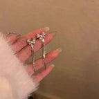 81-Zircon Bow Tassel Mosquito Coil Ear Clip