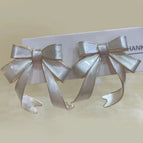 Quicksand White Bow Earrings