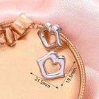 19.5x21.5mm (Needle Thickness: 0.7mm) / Hollow Heart Lip Earrings (Steel Color) / 1 Pair/Package