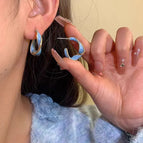 Blue twisted hoop earrings