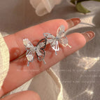 75#Camellia silver hollow butterfly stud earrings