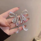 Silver sparkling diamond bow earrings