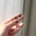 Minimalist black hollow flower Silver Needle