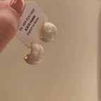 Creamy white drop glaze curved earrings