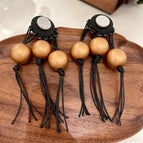 2512003 Black Wooden Gold Beaded Tassel Earrings (S925 Silver Needle)