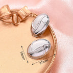 27x19mm (Needle Thickness: 0.7mm) / Free Line Oval Earrings (Steel Color) / 1 Pair/Package