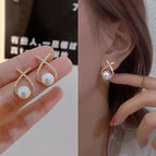 X-shaped cross pearl stud earrings