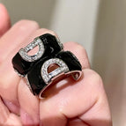 2512097 Black Oil Drop Letter Zircon Earrings