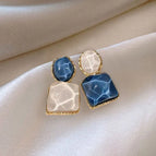 4# Asymmetric blue stud earrings