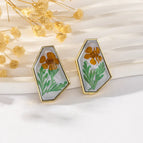 Orange Flowers and Green Leaves on Gray Background