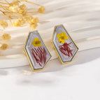 Yellow Flowers and Red Leaves on Gray Background