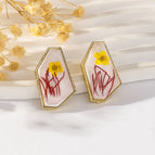 Yellow Flowers and Red Leaves on White Background