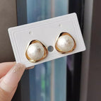 White hollow pearl earrings